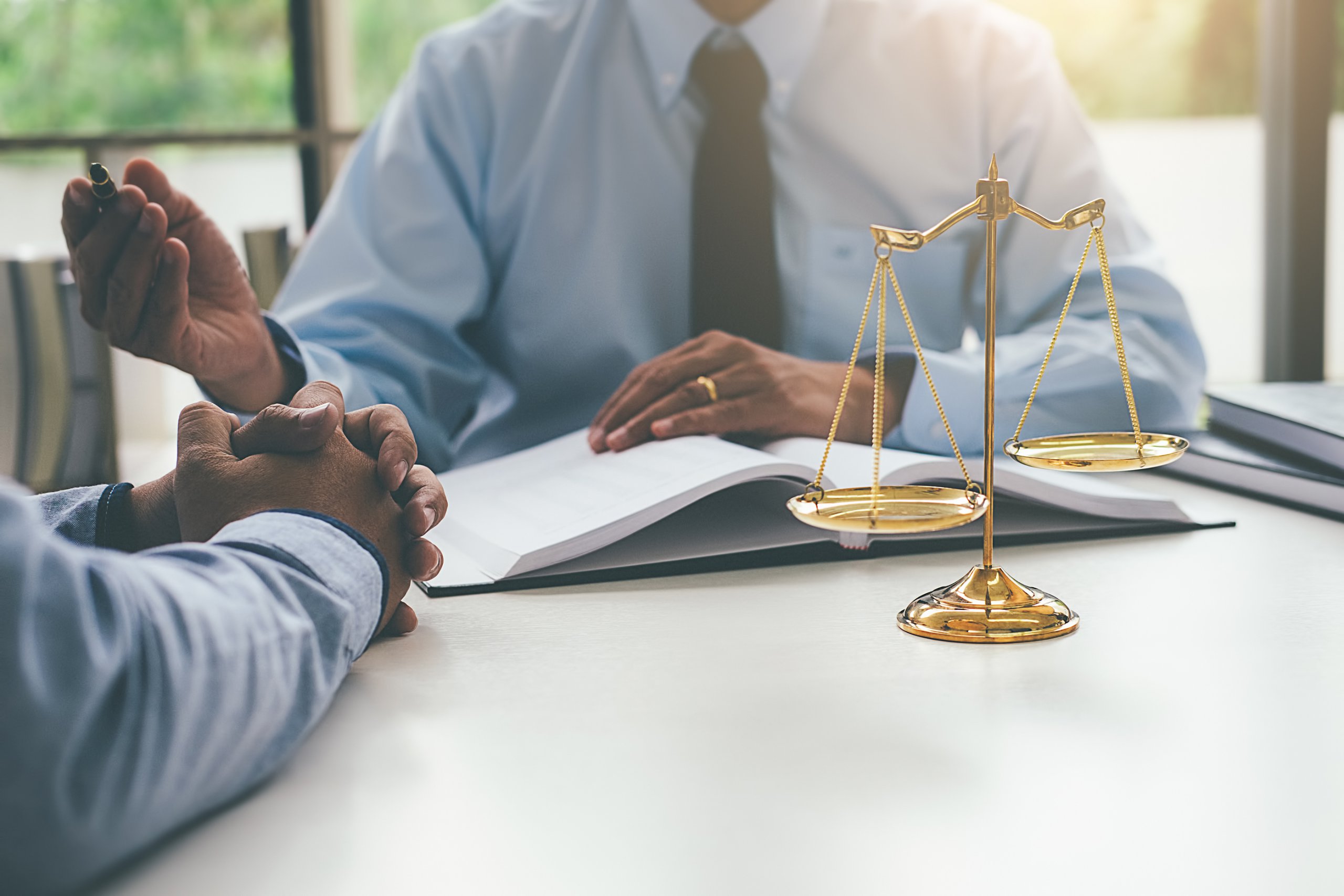 Client sitting with personal injury attorney