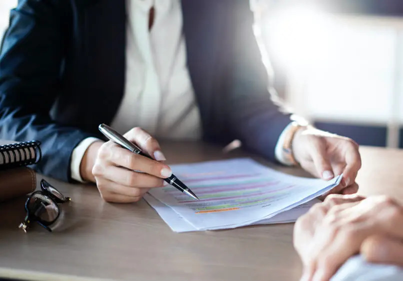 Attorney reviews paperwork with client