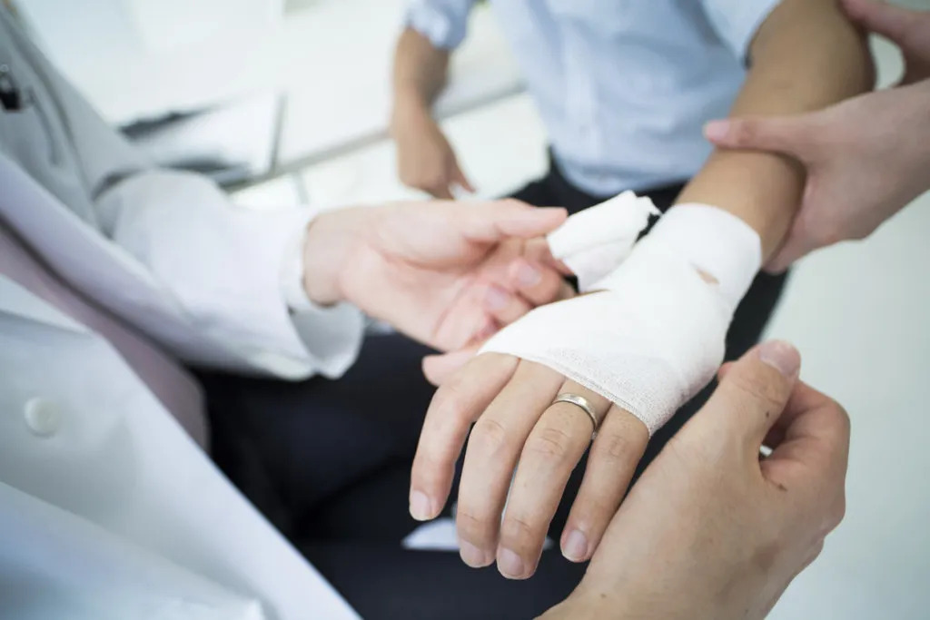 Man receiving treatment for dog bite injury