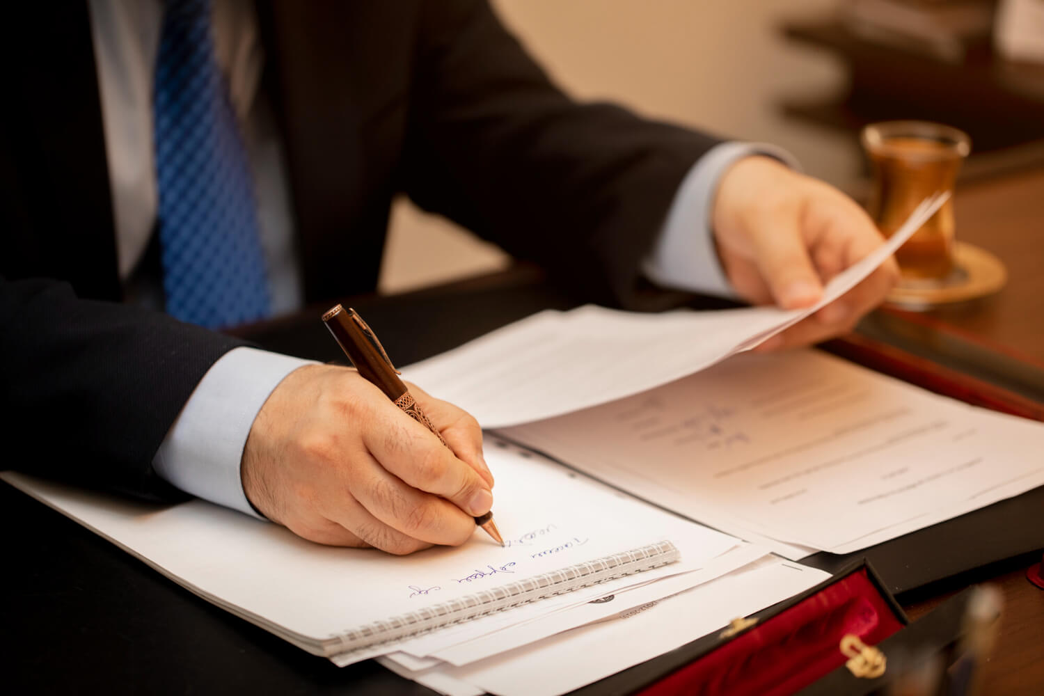lawyer taking notes in court room