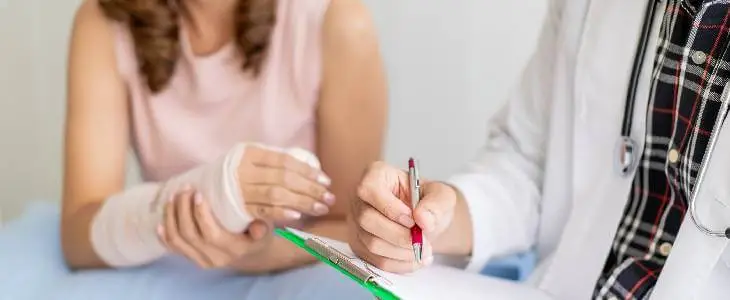 female with broken arm visiting a doctor in Northern Virginia